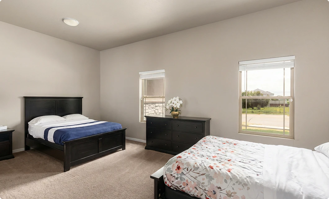 A private resident bedroom with calming decor