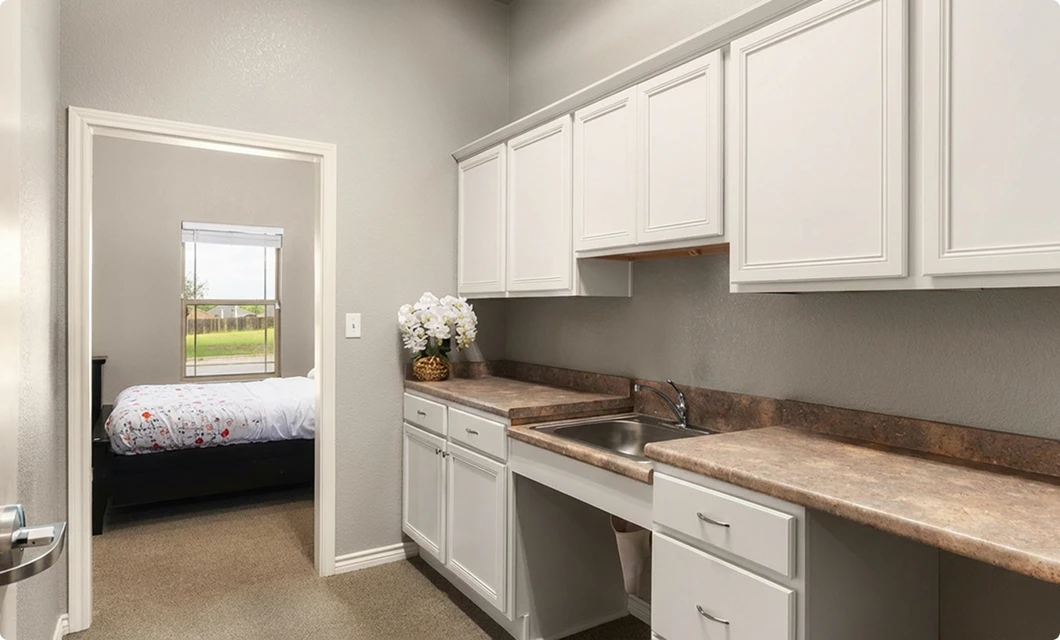 Full kitchen with white cabinetry